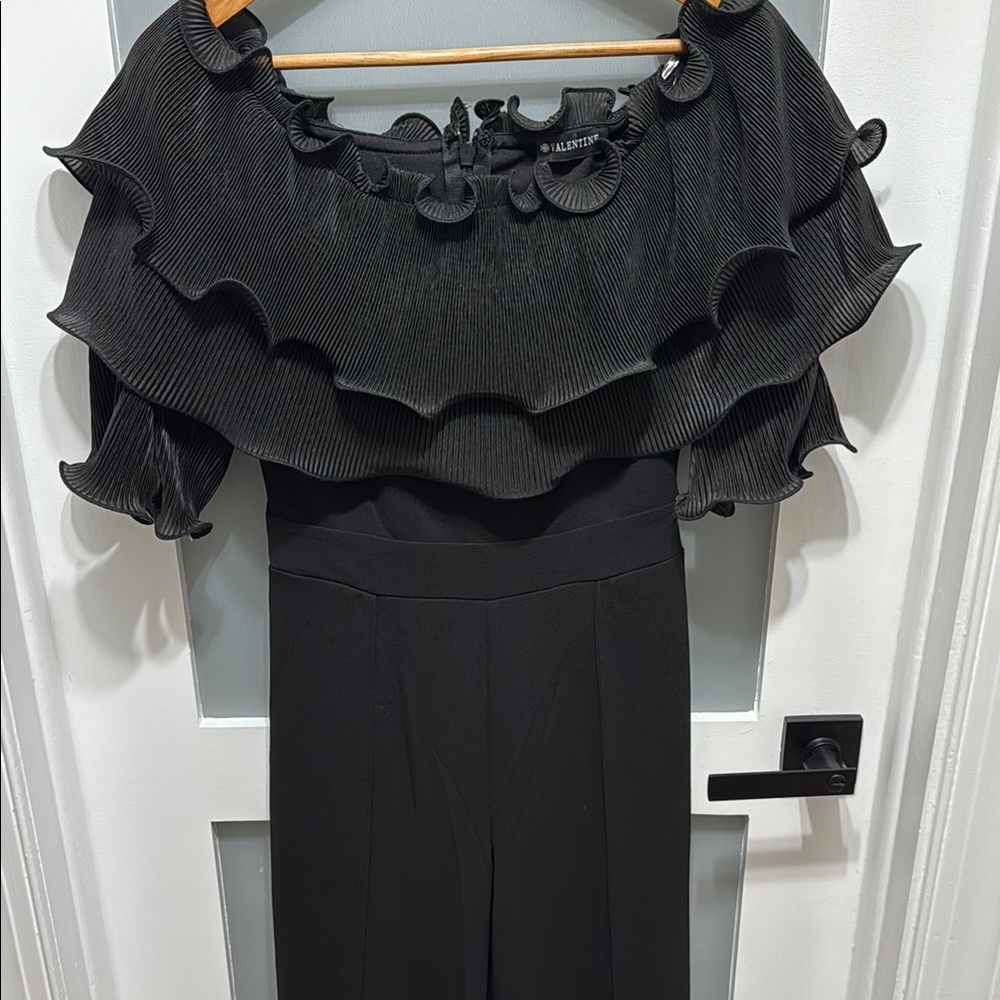 Black Jumpsuit with Dramatic Ruffled Top and Form-Fitting Silhouette